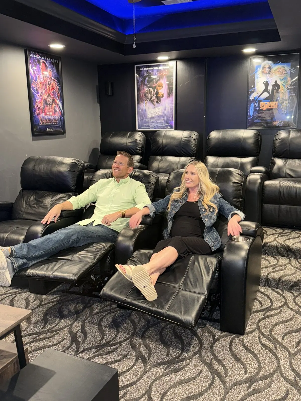 Guests relaxing in the private home theater