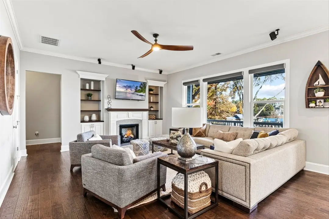 Serene living room with deep sofas, fireplace, and ambient glow