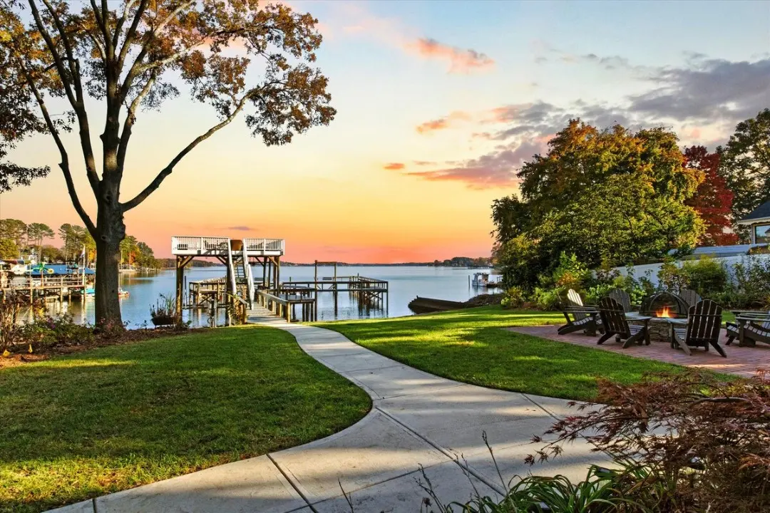 Serene lakeside evening with fire pit and sunset